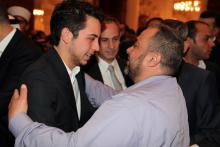 H.R.H. Crown Prince Al Hussein bin Abdullah II speaks to a fellow worshiper after Friday prayers, 2013