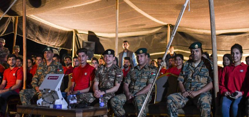 Crown Prince, accompanied by Haqiq initiative participants, attends night military drill