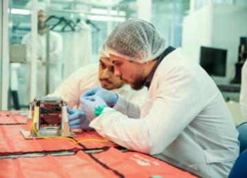 Crown Prince helps assemble final piece of Jordan’s first nanosatellite, records audio message to be transmitted from space